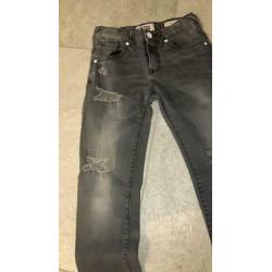 Stoere grijs/zwart spijkerbroek Vingino maat 140
