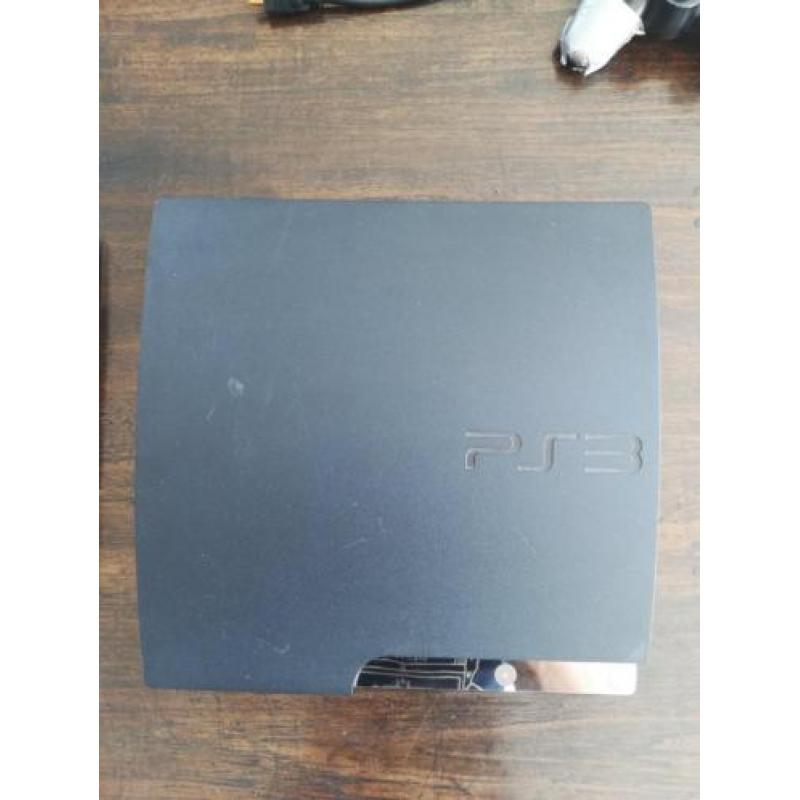 Playstation 3 Slim 160 GB met kabels en 4 spellen