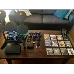 Ps3 met 11 games+3 controllers+stuur & drumstel