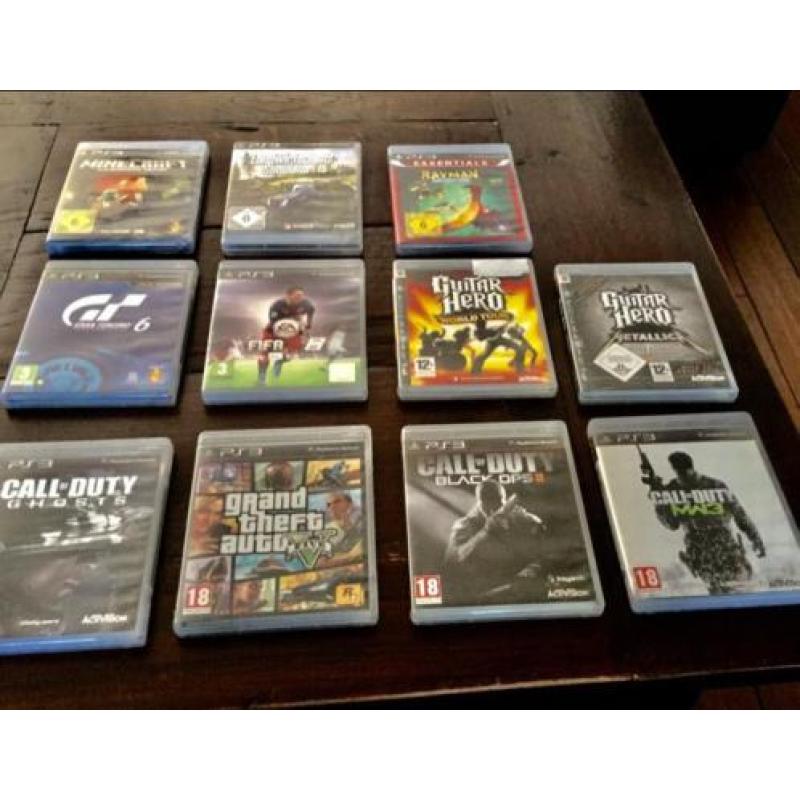 Ps3 met 11 games+3 controllers+stuur & drumstel